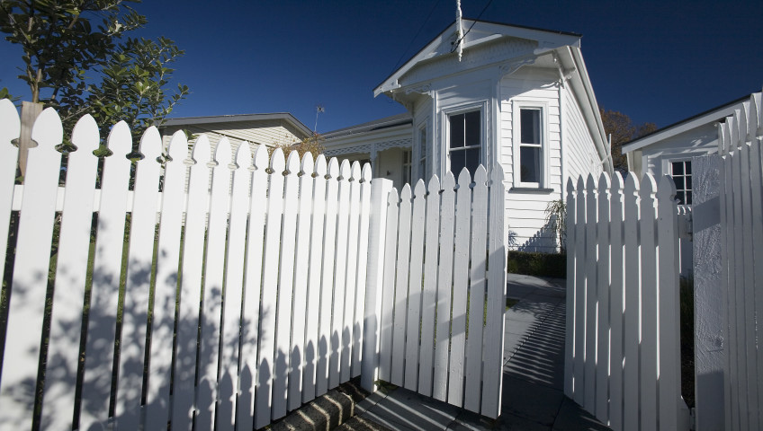 A white house with a wooden fence. Knoxville TN